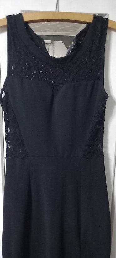 Elegantna duga crna haljina bez rukava. - Kroj: uska silueta koja na lalafo.rs Elegantna duga crna haljina bez rukava. - Kroj: uska silueta koja