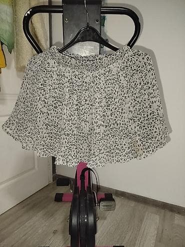 Muška odeća: Ženska plisirana mini suknja sa leopard printom. - Boja: bela osnova — 1