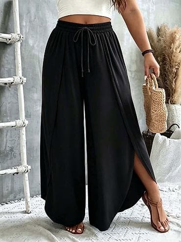 new yorker cargo pantalone: Crne široke ženske pantalone sa preklopom i prorezima sa strane. - — 1