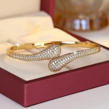 bez ranac: Elegantna ženska narukvica – zlatni ton, otvoreni dizajn sa kapljastim — 3