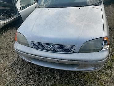 prodaja sedista za automobile: Delovi Suzuki Swift GLX – srebrni hečbek - Generacija sa petoro — 2