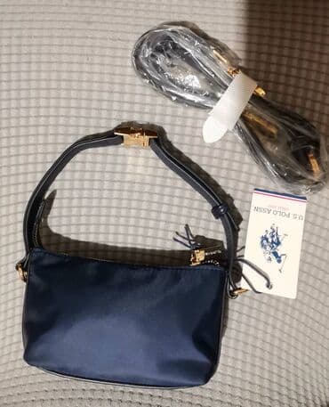 krzna za jakne: 50% NIZA CENA
NOVO SA ETIKETOM!
U. S. POLO TORBICA - DIMENZIJE 18X11CM — 2