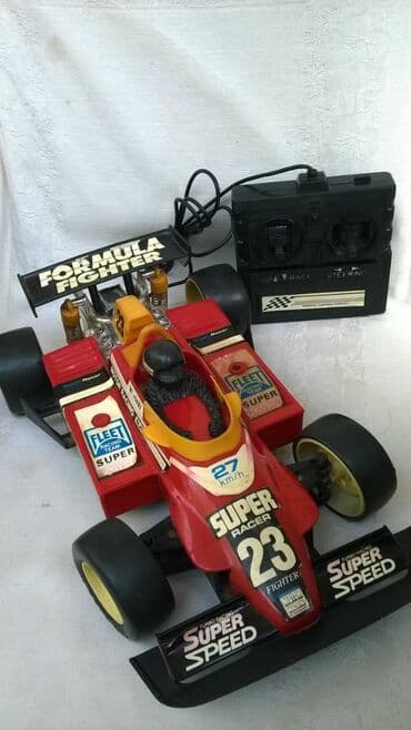 svrca auto na akumulator: Na daljinski auto Formula 1:18 (33 cm.) na kabl, ispravan, levo/desno — 1
