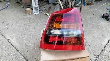 cena polovnih: LEVA STOP LAMPA(ZATAMNJENA) ZA OPEL ASTRA G OD 1998. DO 2004. GOD. | — 1