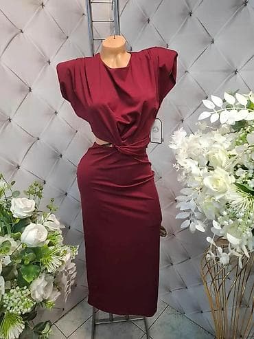 Elegantna ženska haljina midi dužine sa asimetričnim čvorom u struku