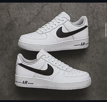 36 patike: Klasične bele patike sa niskim profilom i crnim Swoosh logotipom — 1