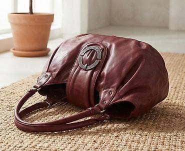 parfois sat: Bordo ženska torba od meke kože, elegantnog zaobljenog oblika. Dve — 1