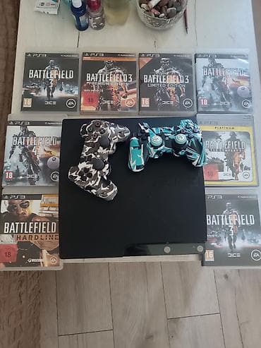 rostilj beli: PlayStation 3 Slim konzola (crna) sa 2 bežična DualShock 3 kontrolera — 1