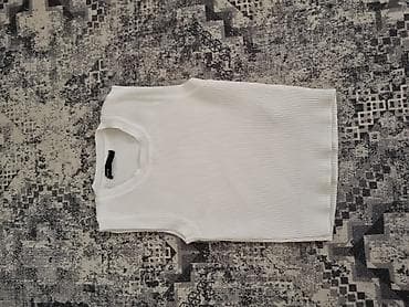 torbica koja trepce: Beli rebrasti ženski top bez rukava - Kroj: uski, bez rukava, okrugli — 1