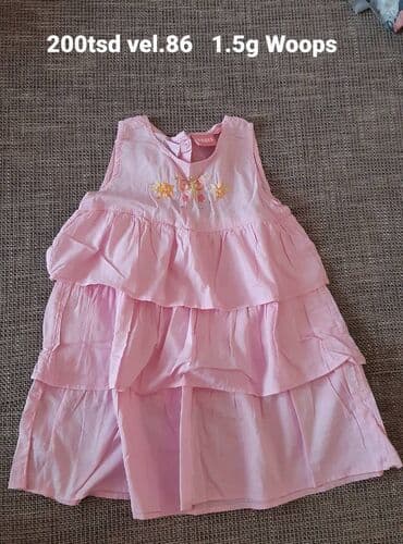 Dečija haljina Woops, bez rukava, roze boje. Model sa više volana