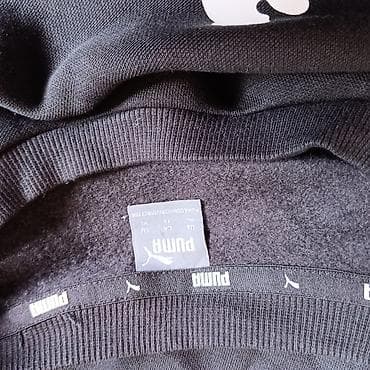 Muška odeća: Crna muška dukserica bez rajsferšlusa sa velikim PUMA logotipom — 2