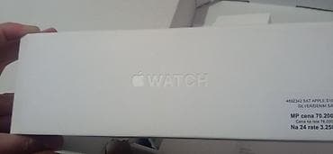 satovi swatch: Apple Watch sa sportskom narukvicom (plava) i magnetnim punjačem. Nov — 6