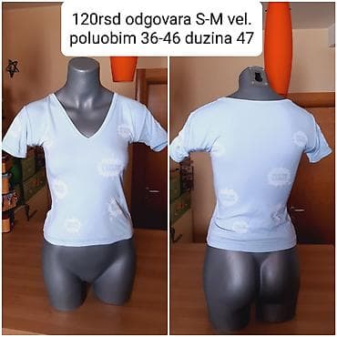 Ženska majica kratkih rukava, svetloplave boje, sa V-izrezom. Na