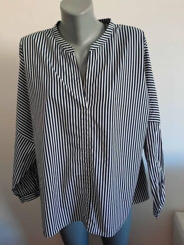 Kosulja Esprit 48 cena 850
pamuk
sirina grudi 72 duzina ledja 67 — 1