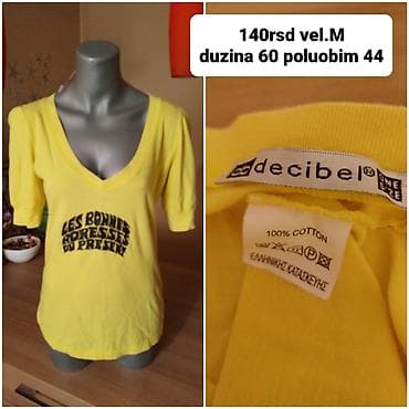 Ženska majica Decibel, žuta, sa V-izrezom i kratkim rukavima. Na