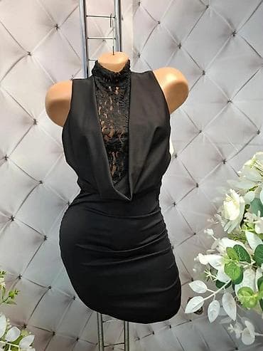 Elegantna crna mini haljina bez rukava, idealna za večernje izlaske i