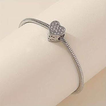 van cleef narukvica cena: Srebrnasta narukvica sa šarmom u obliku srca - Elegantna „snake — 2