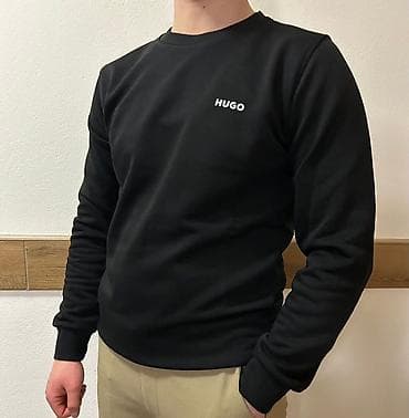 Coats and trench coats: Muški crni duks – više modela sa diskretnim logom na grudima - Boja — 1