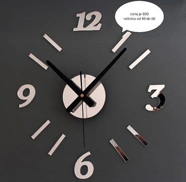 Sat u kombinaciji sa brojevima i crticama u crnoj boji sa efektom na lalafo.rs Sat u kombinaciji sa brojevima i crticama u crnoj boji sa efektom