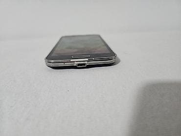 pixi 4: Na prodaju Samsung Galaxy S5 mini u crnoj boji. Telefon je fizički — 7