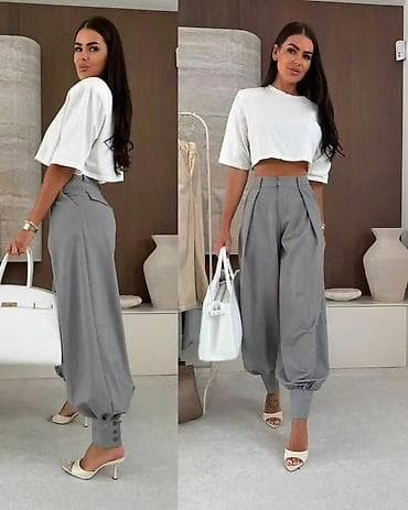 straus pantalone: Ženske elegantne pantalone sa spuštenim krojem i manžetnama - Model — 2