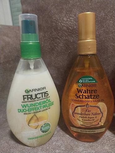 Set proizvoda za negu i zaštitu kose – razni leave‑in sprejevi, ulja i