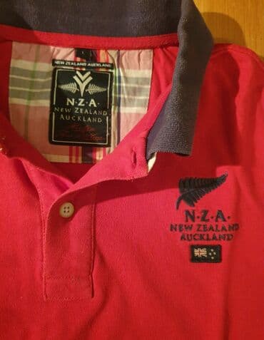 c a jakne 2017: NZA NEW ZEALAND Auckland polo majica crvena sa kragnicom. L velicina — 1