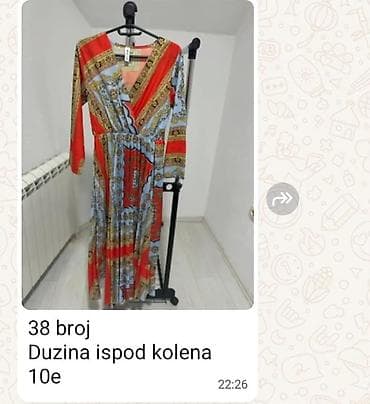 Haljine: - Elegantna crno-bela haljina bez rukava, midi dužine. Kroj naglašava — 2