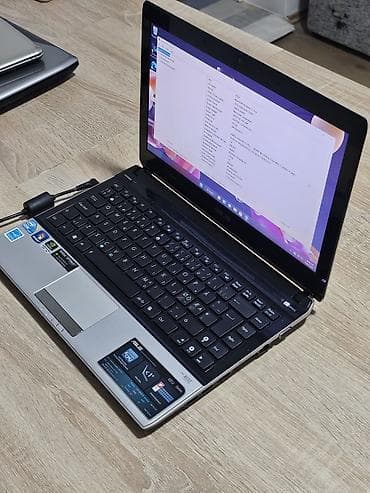 ASUS laptop (serija U/UL) – srebrno kućište sa crnim detaljima