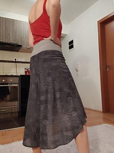 prsluk s: Asimetrična suknja sa elastičnim pojasom - Model: midi dužina — 1
