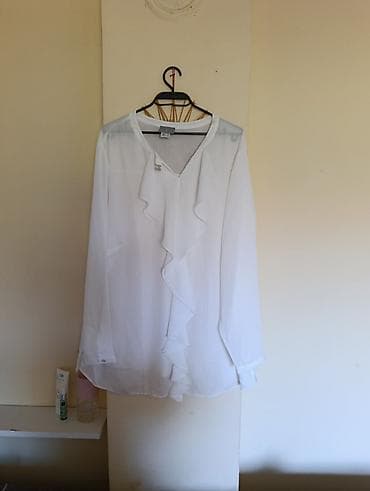 suknje til: Elegantna bela ženska bluza sa dugim rukavima i V-izrezom. Model je od — 1