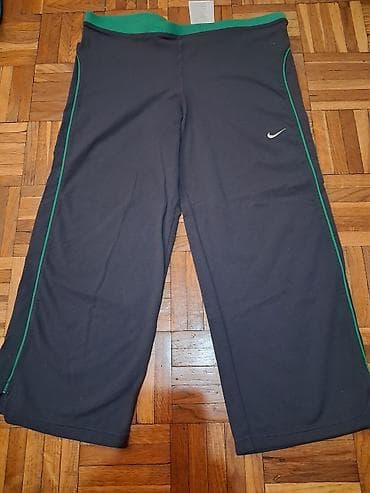 Donji deo: Nike ženske sportske pantalone – model sa širokim nogavicama - — 1