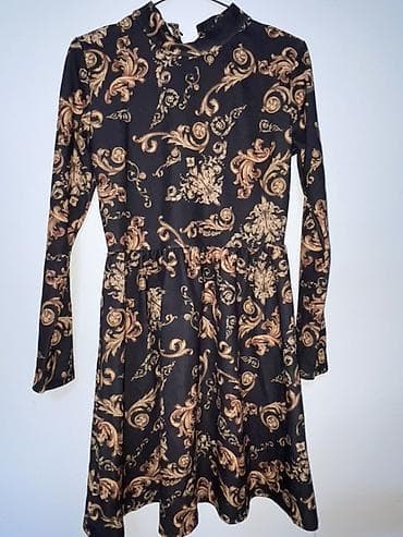 Haljina sa dugim rukavima, crne osnove sa baroknim zlatno‑bež na lalafo.rs Haljina sa dugim rukavima, crne osnove sa baroknim zlatno‑bež