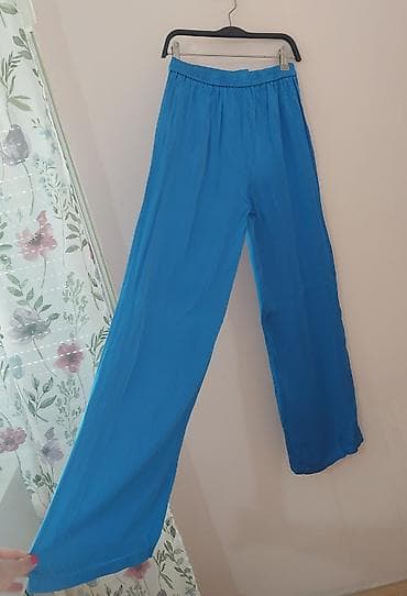 Pants: Ženske pantalone širokog kroja u intenzivnoj tirkizno-plavoj boji. - — 2
