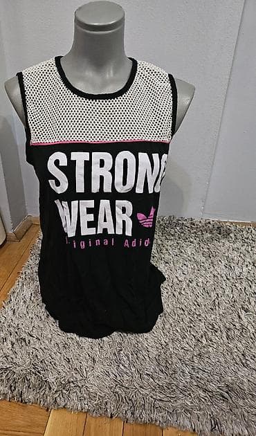 Majice i topovi: Ženska sportska majica bez rukava „STRONG WEAR“.
S/M vel — 1