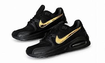 Patike: Crne sportske patike sa zlatnim Swoosh detaljem. Dizajn sa debelim — 1