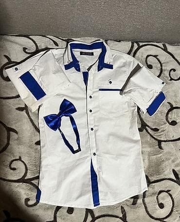 Bela košulja sa leptir mašnom
S velicina na lalafo.rs Bela košulja sa leptir mašnom
S velicina