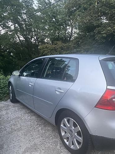 migavac za retrovizor golf 5: Volkswagen Golf V, srebrna boja, 5 vrata (hečbek). Alu felne sa VW — 2