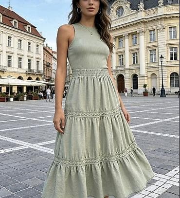 Ženska midi suknja sa volanima i čipkastim detaljima. - Kroj: midi