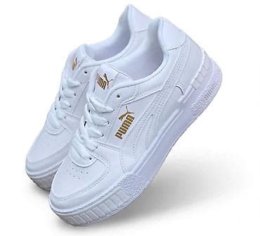 Puma bele patike modernog, urbanog dizajna. Model je nizak, sa