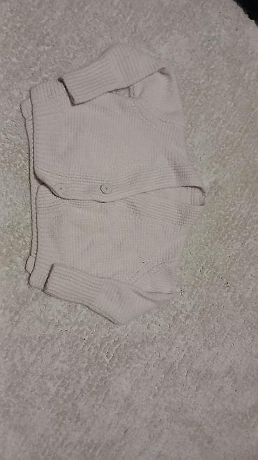 Bež kardigan : mekani rebrasti plet, dugi rukavi, kopčanje napred sa na lalafo.rs Bež kardigan : mekani rebrasti plet, dugi rukavi, kopčanje napred sa