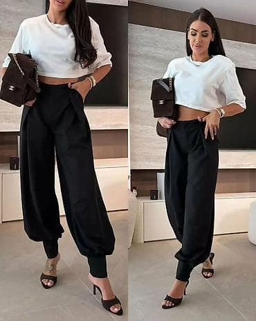 straus pantalone: Ženske elegantne pantalone sa spuštenim krojem i manžetnama - Model — 4