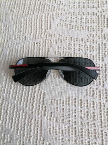 top coat: Sunglasses, Prada — 8