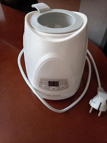 donji deo skafandera za decu: Grejač/sterilizator za flašice – Mililand - Električni grejač za bebi — 1