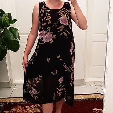 Haljina L/XL Kopca se sa jedne strane celom duzinom dugmici, slic