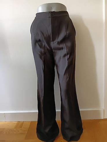Elegantne crne pantalone sa širokom nogavicom. Detalji: - Kroj