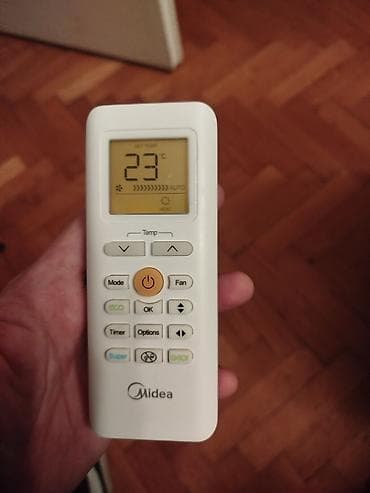 Mašine za šivenje: Daljinski za klimu Midea.Ispravan — 3