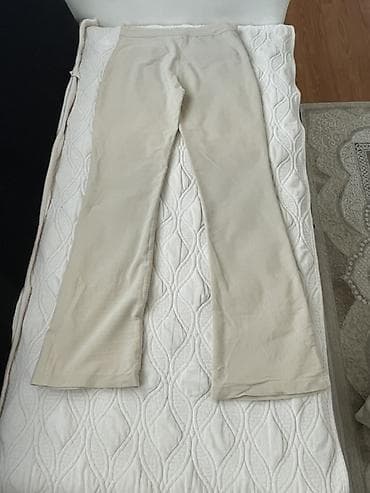 bata obuca srbija: Bež ženske pantalone sa blagim širenjem nogavica. Visina struka — 2
