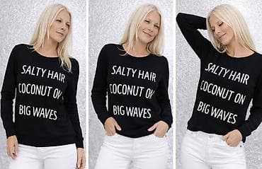 Ženski crni džemper sa natpisom “SALTY HAIR COCONUT ON BIG WAVES”. -