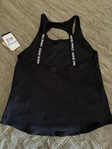 Lične stvari: Nike Pro Women's Dri-FIT Tank Top vel. S, M 
Recycled Materials
IB — 7
